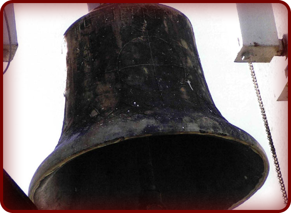 There is a metal piece that hangs from the center of the bell. As the bell swings, this metal part strikes the bell and causes it to vibrate. We hear the vibrations as the bell continues to ring.